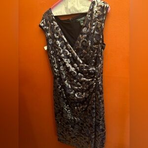 This is an evening dress worn once/ dry. It has lace, floral sequined overlay.